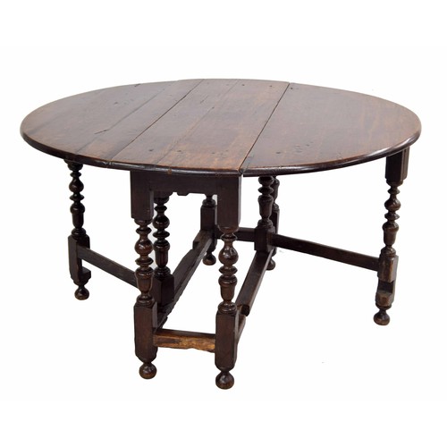 362 - 17th century oak drop-leaf dining table, 50