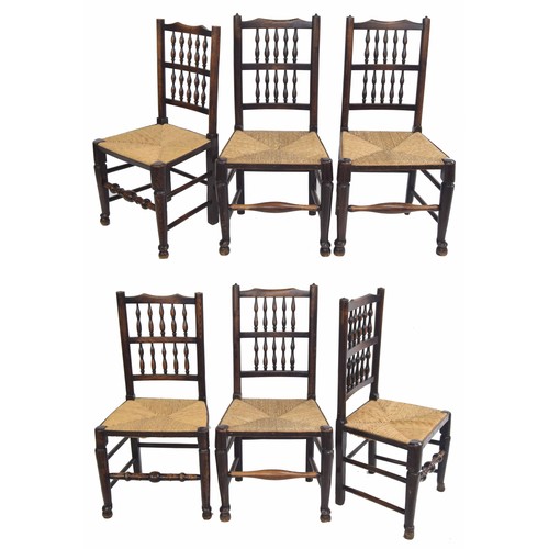 364 - Harlequin set of six rush seat oak dining chairs, (3 and 3) with ladder back, raised upon turned fro... 