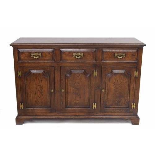 355 - Georgian style oak dresser base, the moulded top over three short drawers and three panelled cupboar... 