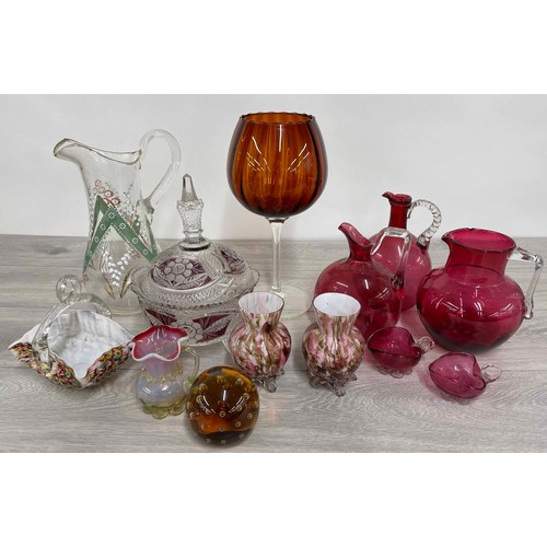 185 - Selection of cranberry glass jugs; together with a cranberry overlaid bowl and cover, an overlaid hi... 