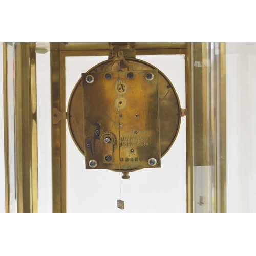 1513 - Good brass four glass torsion mantel clock, the movement back plate inscribed D.R.P. no. 144888 and ... 