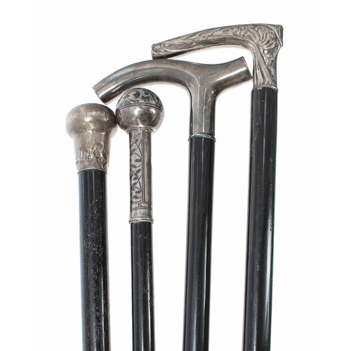 641 - Four silver topped walking sticks formerly belonging to Yehudi Menuhin, one marked for London 1903 w... 