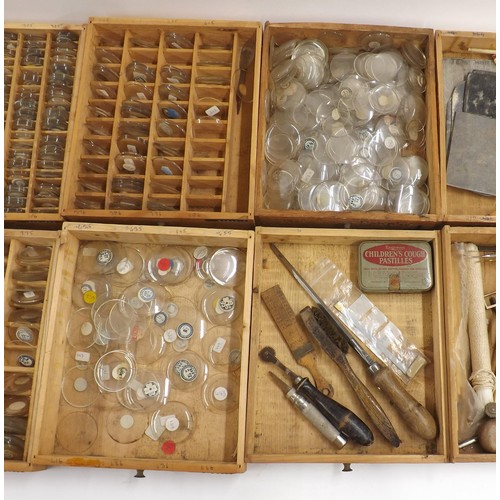 506 - Wooden chest containing a quantity of various sized watch glasses, quantity of various watch/clock m... 