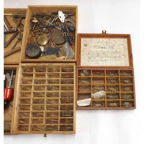 506 - Wooden chest containing a quantity of various sized watch glasses, quantity of various watch/clock m... 