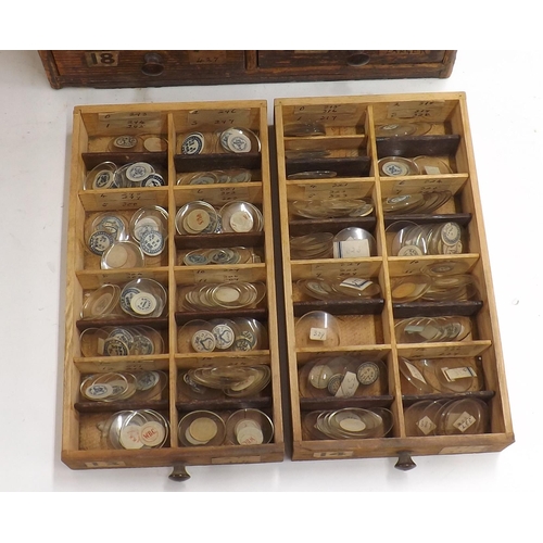 507 - Twenty four drawer wooden chest containing a large quantity of watch glasses, various sizes 94-428, ... 