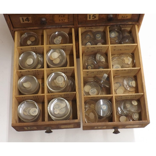 507 - Twenty four drawer wooden chest containing a large quantity of watch glasses, various sizes 94-428, ... 