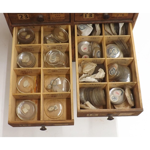 507 - Twenty four drawer wooden chest containing a large quantity of watch glasses, various sizes 94-428, ... 