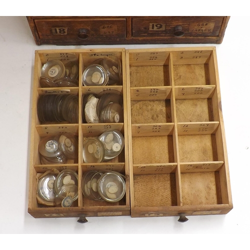 507 - Twenty four drawer wooden chest containing a large quantity of watch glasses, various sizes 94-428, ... 