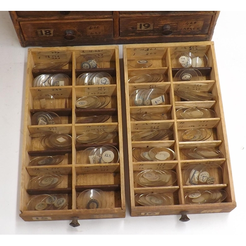 507 - Twenty four drawer wooden chest containing a large quantity of watch glasses, various sizes 94-428, ... 