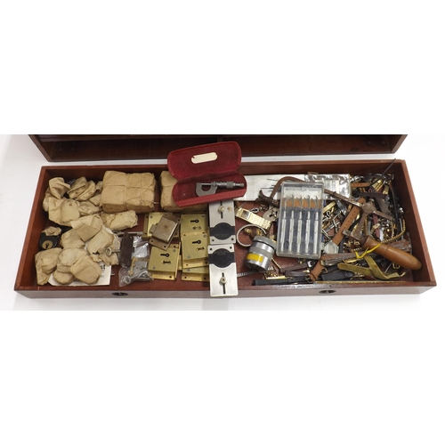 605 - Six drawer wooden chest containing an assortment of watch and clock parts, accessories and tools to ... 