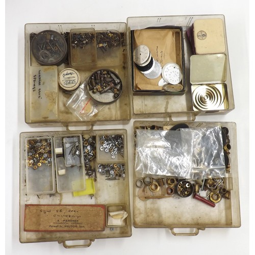 607 - Selection of watch parts contained within four chests to include dials, crowns, pocket watch buttons... 