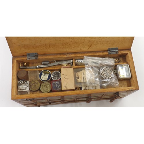 607 - Selection of watch parts contained within four chests to include dials, crowns, pocket watch buttons... 