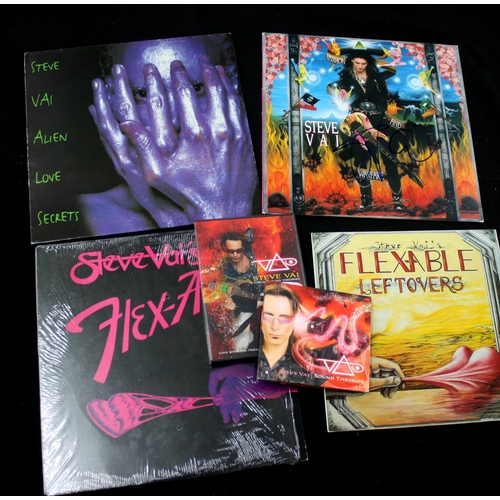 573 - Steve Vai - Four vinyl records to include a signed copy of the 1990 album 'Passion & Warfare', i... 