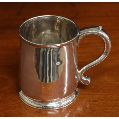 575 - George II silver tankard, with an S scroll handle upon a circular steeped foot, maker Gabriel Sleath... 