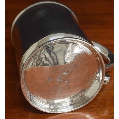 575 - George II silver tankard, with an S scroll handle upon a circular steeped foot, maker Gabriel Sleath... 