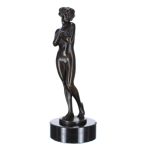 642 - Art Deco figural bronze female nude, modelled standing mounted upon a circular marble socle, 11