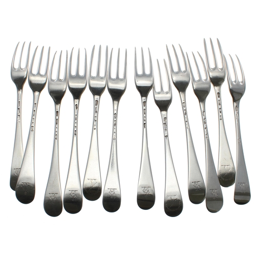 569 - Matched set of twelve George II/III Hanoverian pattern silver table forks, each bearing a matching k... 