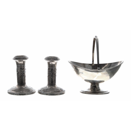 572 - Pair of squat silver column candlesticks, repoussé decorated with bow and swag motif, maker W.J Myat... 