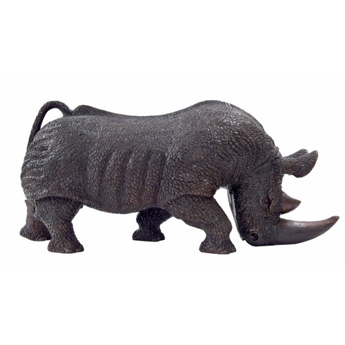 658 - Large solid carved wood sculpture of a rhinoceros, 27