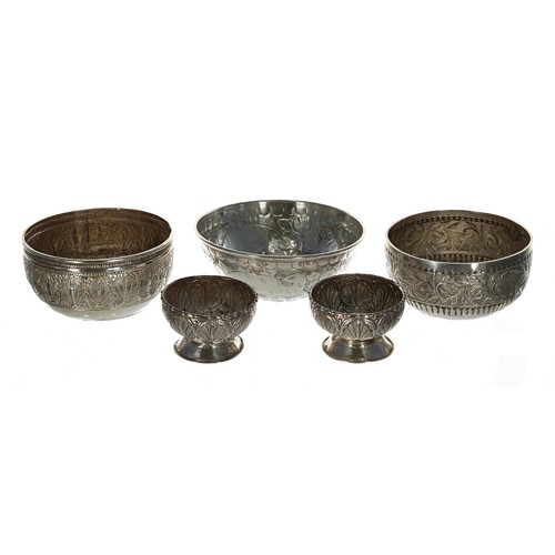 606 - Two similar Indian white metal repousse decorated bowls, 4