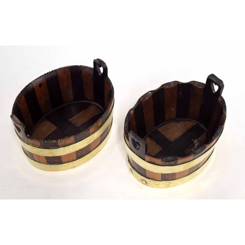 645 - Similar pair of brass coopered oval mahogany and fruit wood baskets, possibly apprentice pieces with... 