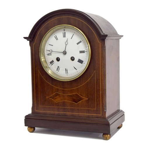 653 - Mahogany inlaid two train arch top mantel clock, 4.5