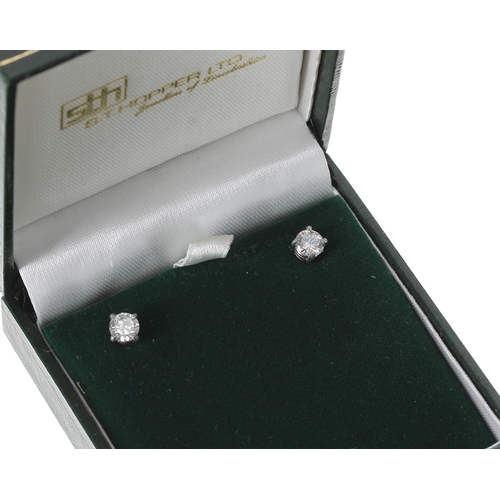 143 - Pair of modern 18ct white gold diamond stud earrings, round brilliant-cut, 0.86ct approx, clarity SI... 