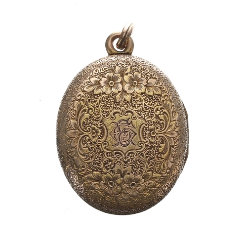 253 - Oval engraved gold locket pendant, with a horseshoe design set with seed pearls, 12gm, 41mm x 25mm... 