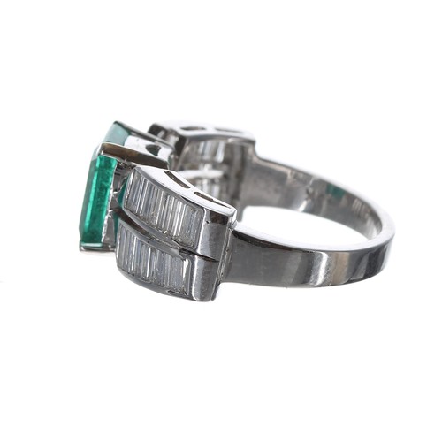 131 - Impressive 18ct white gold emerald and diamond ring, the emerald 1.70ct approx, with split shoulders... 