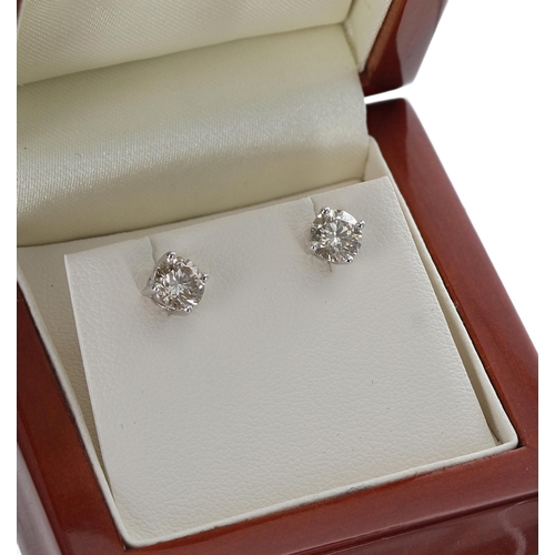 82 - Pair of 18ct white gold diamond ear studs, round brilliant-cut, 1.201ct approx in total, clarity SI,... 