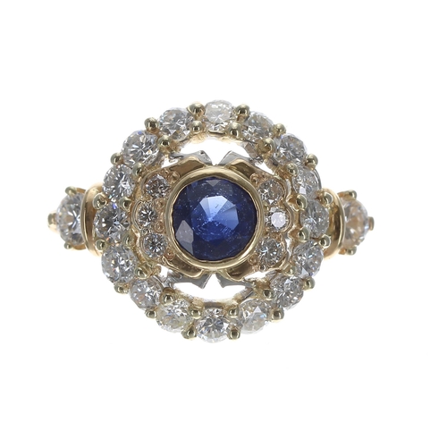 277 - Large fancy 18ct bicolour sapphire and diamond cluster ring, the sapphire of a nice blue colour 1.20... 