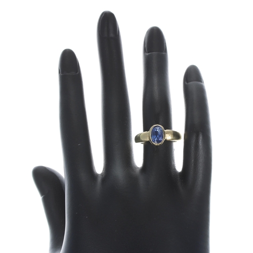 281 - High carat yellow gold backed sapphire single stone ring, rub-over set with an oval sapphire, 1.25ct... 