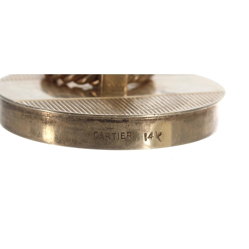 312 - 14k yellow gold engine turned circular pill box signed Cartier, with a rope twist handle set with tw... 