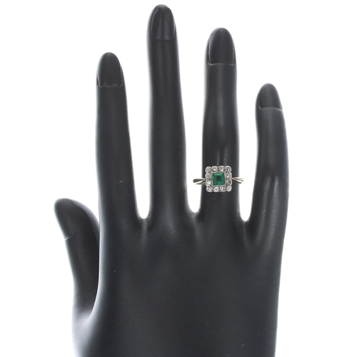 362 - 18ct and platinum emerald and diamond square cluster ring, the princess-cut emerald 0.35ct approx, w... 