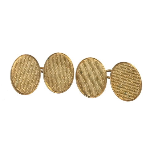 383 - Pair of 18ct oval engine turned cufflinks, Birmingham 1923, 7.5g, 16mm ** with a tan leather case ... 