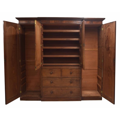 961 - Victorian mahogany breakfront triple robe, surmounted by a moulded cornice over central cupboard doo... 