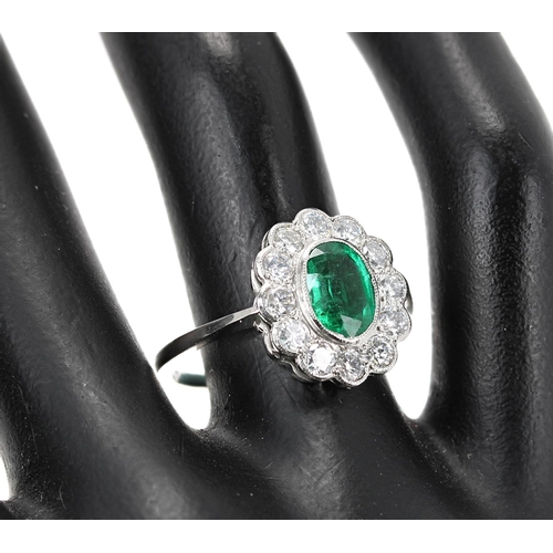 150 - Fancy emerald and diamond platinum oval cluster ring, the emerald 1.10ct approx, in a surround of ro... 