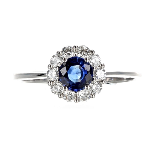 420 - Pretty 18ct white gold sapphire and diamond cluster ring, the sapphire of a rich blue colour estimat... 