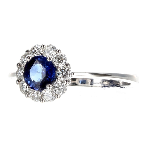 420 - Pretty 18ct white gold sapphire and diamond cluster ring, the sapphire of a rich blue colour estimat... 