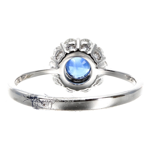 420 - Pretty 18ct white gold sapphire and diamond cluster ring, the sapphire of a rich blue colour estimat... 