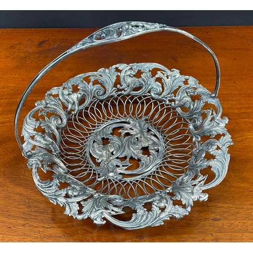 609 - Decorative Indian open work white metal basket, with a scrolling foliate outer rim border with hunte... 