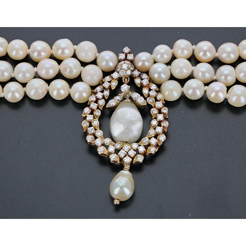 197 - Fancy three row cultured pearl necklace with a yellow gold diamond set pendant and gold clasp, 80.3g... 