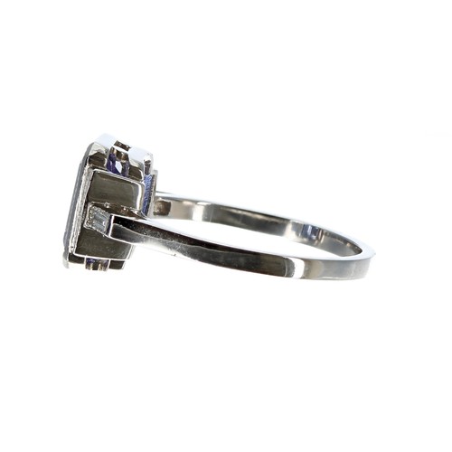 313 - Platinum tanzanite and diamond ring in the Art Deco style, the tanzanite 2.60ct approx, flanked to e... 