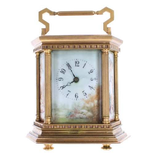 1239 - Contemporary porcelain panelled carriage clock, within an hexagonal case painted with a floral lands... 