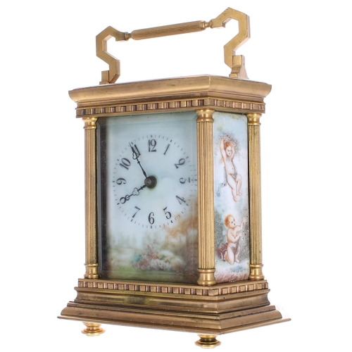 1239 - Contemporary porcelain panelled carriage clock, within an hexagonal case painted with a floral lands... 