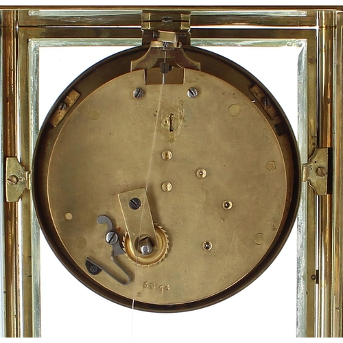 1510 - Brass four glass torsion mantel clock, the 3.75