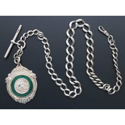 333 - Heavy graduated silver curb link watch Albert chain, with an enamel football medallion fob, T-bar an... 