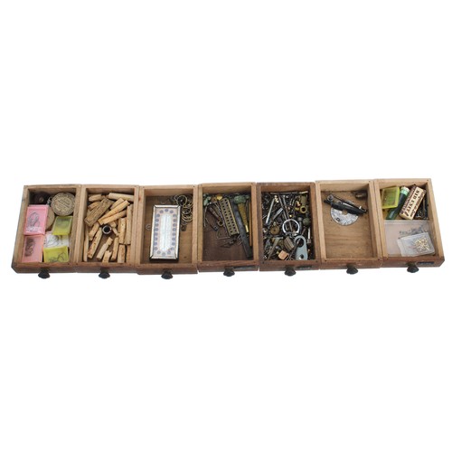 529 - Twenty one drawer wooden chest containing a quantity of watch parts to include fusee chain, hands, b... 