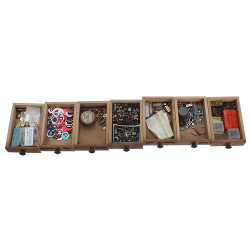 529 - Twenty one drawer wooden chest containing a quantity of watch parts to include fusee chain, hands, b... 