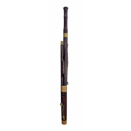 1809 - A ten-keyed stained maple bassoon by Beltrami, Lugano, first quarter 19th century, the keys of brass... 